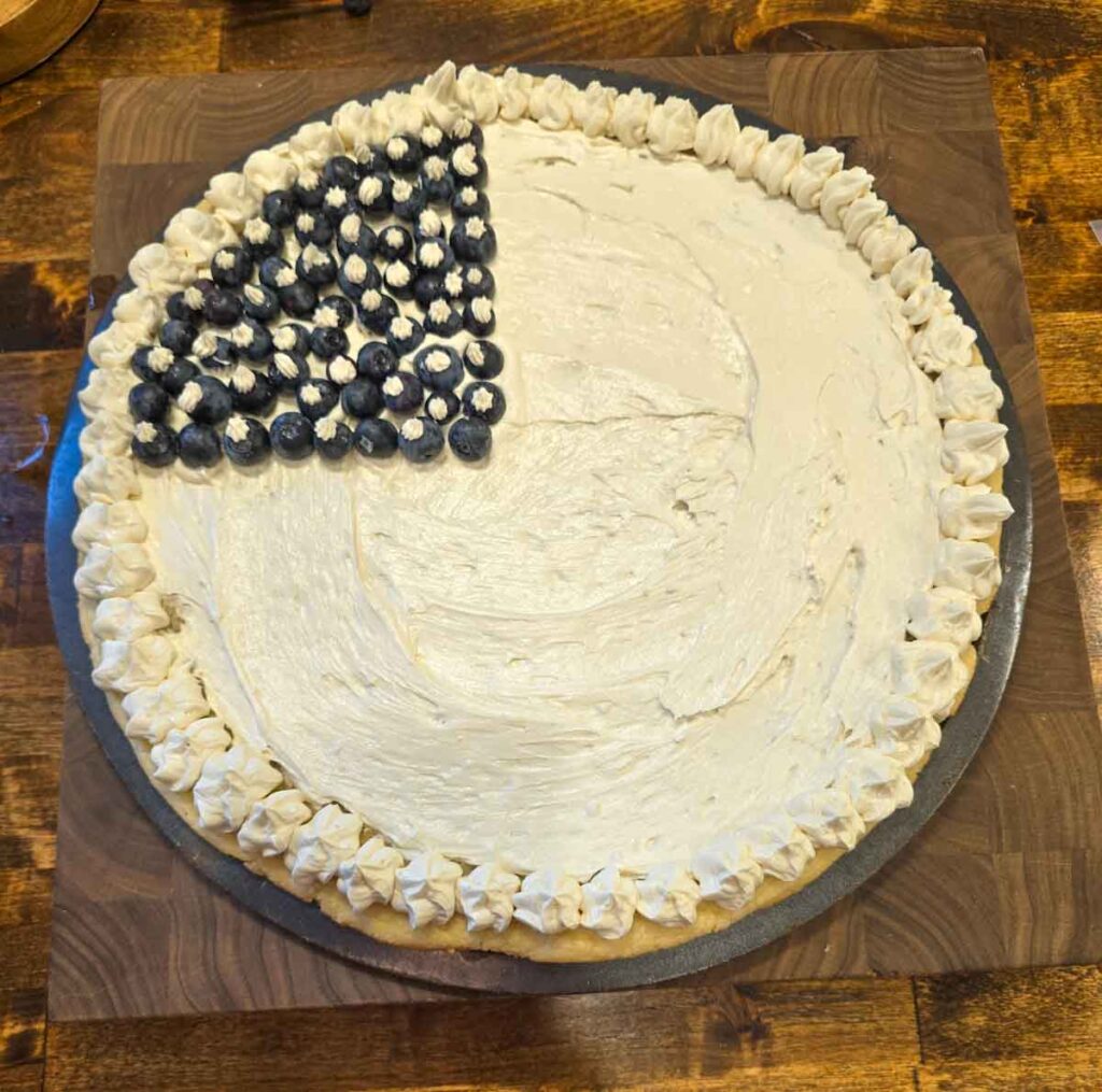 White iced sugar cookie with blueberries